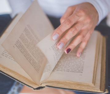 Person Paging Through Bible Person Paging Through Bible